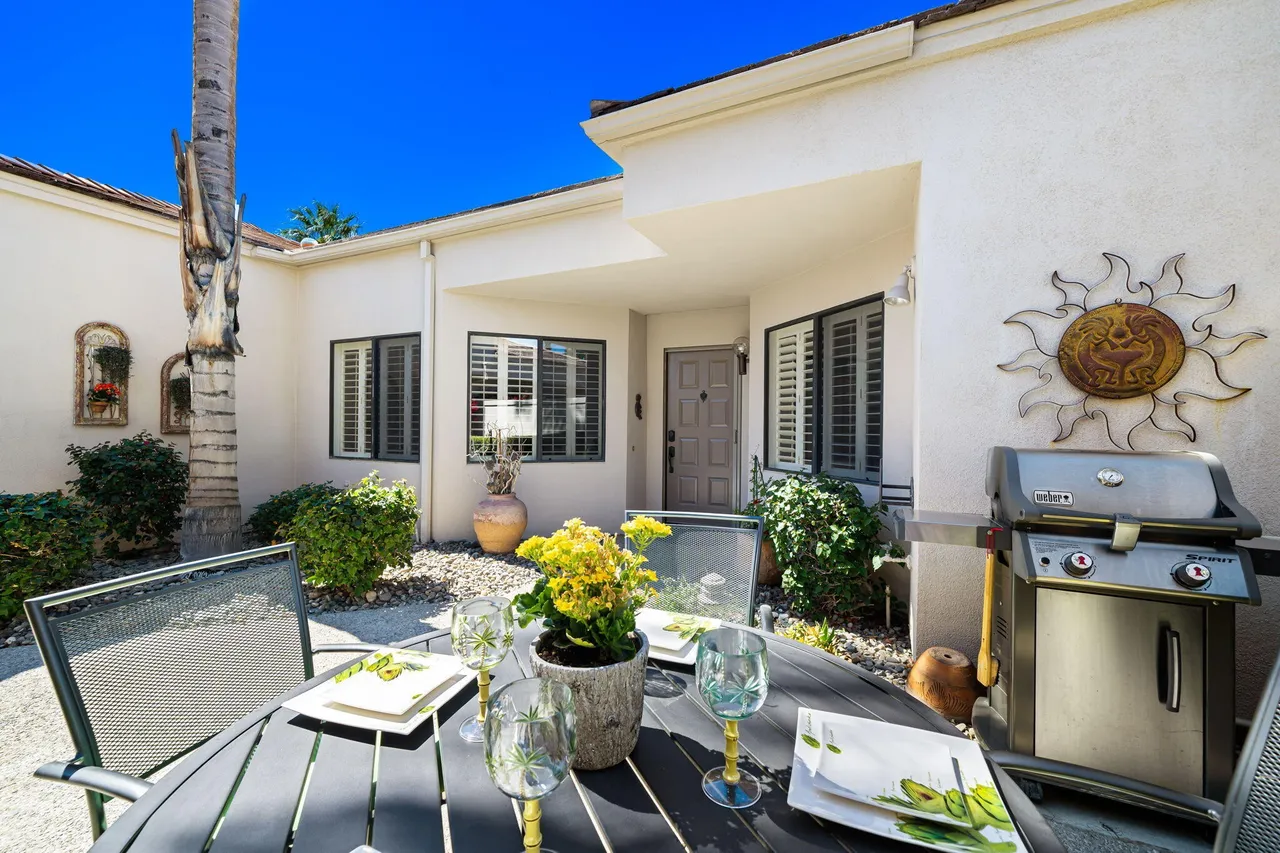 Patio with grill and dining table